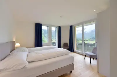Ein Bett oder Betten in einem Zimmer der Unterkunft Bellevue Hotel & Apartments