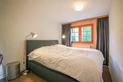 Ein Bett oder Betten in einem Zimmer der Unterkunft Chalet Quattro