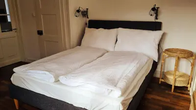 Ein Bett oder Betten in einem Zimmer der Unterkunft Swiss Holiday Apartments