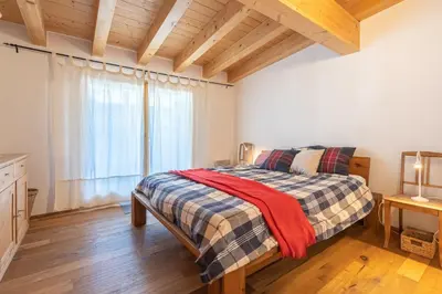 Ein Bett oder Betten in einem Zimmer der Unterkunft Alphubel Apartment Täsch by HomeFlow