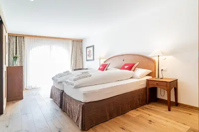 Ein Bett oder Betten in einem Zimmer der Unterkunft Haus Whymper by Zermatt Premium Apartments