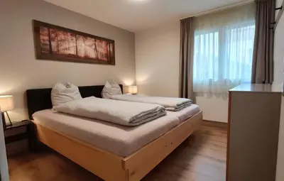 Ein Bett oder Betten in einem Zimmer der Unterkunft Ferienwohnung Träumli