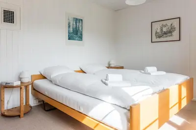 Ein Bett oder Betten in einem Zimmer der Unterkunft Chalet Lienzhubel - GRIWA RENT AG