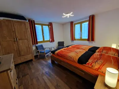 Ein Bett oder Betten in einem Zimmer der Unterkunft Chalet-Daheim-Fiesch 3,5-Zimmerwohnung