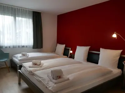 Ein Bett oder Betten in einem Zimmer der Unterkunft Apartment Résidence Sans Souci by Interhome