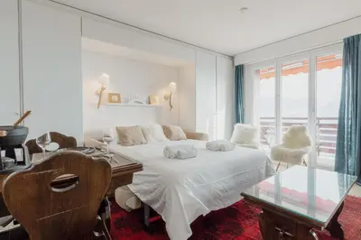 Ein Bett oder Betten in einem Zimmer der Unterkunft Logement avec vue spectaculaire sur les montagnes