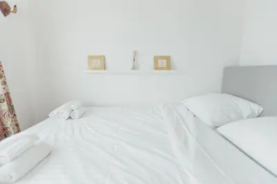 Ein Bett oder Betten in einem Zimmer der Unterkunft Logement avec vue spectaculaire sur les montagnes