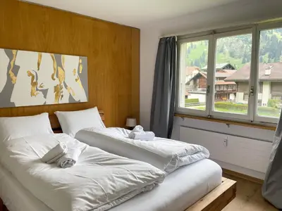 Ein Bett oder Betten in einem Zimmer der Unterkunft Swiss Alps Lodge