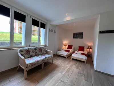 Ein Bett oder Betten in einem Zimmer der Unterkunft Le Manoir 2
