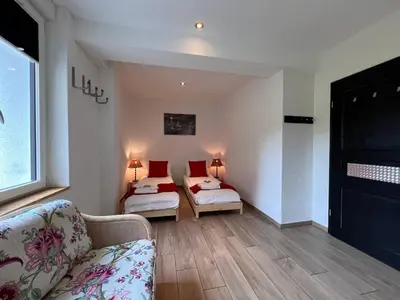 Ein Bett oder Betten in einem Zimmer der Unterkunft Le Manoir 2