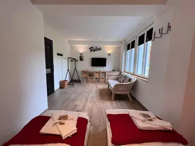 Ein Bett oder Betten in einem Zimmer der Unterkunft Le Manoir 2