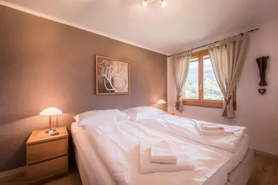 Ein Bett oder Betten in einem Zimmer der Unterkunft Breithorn Apartment, Eiger North Face View